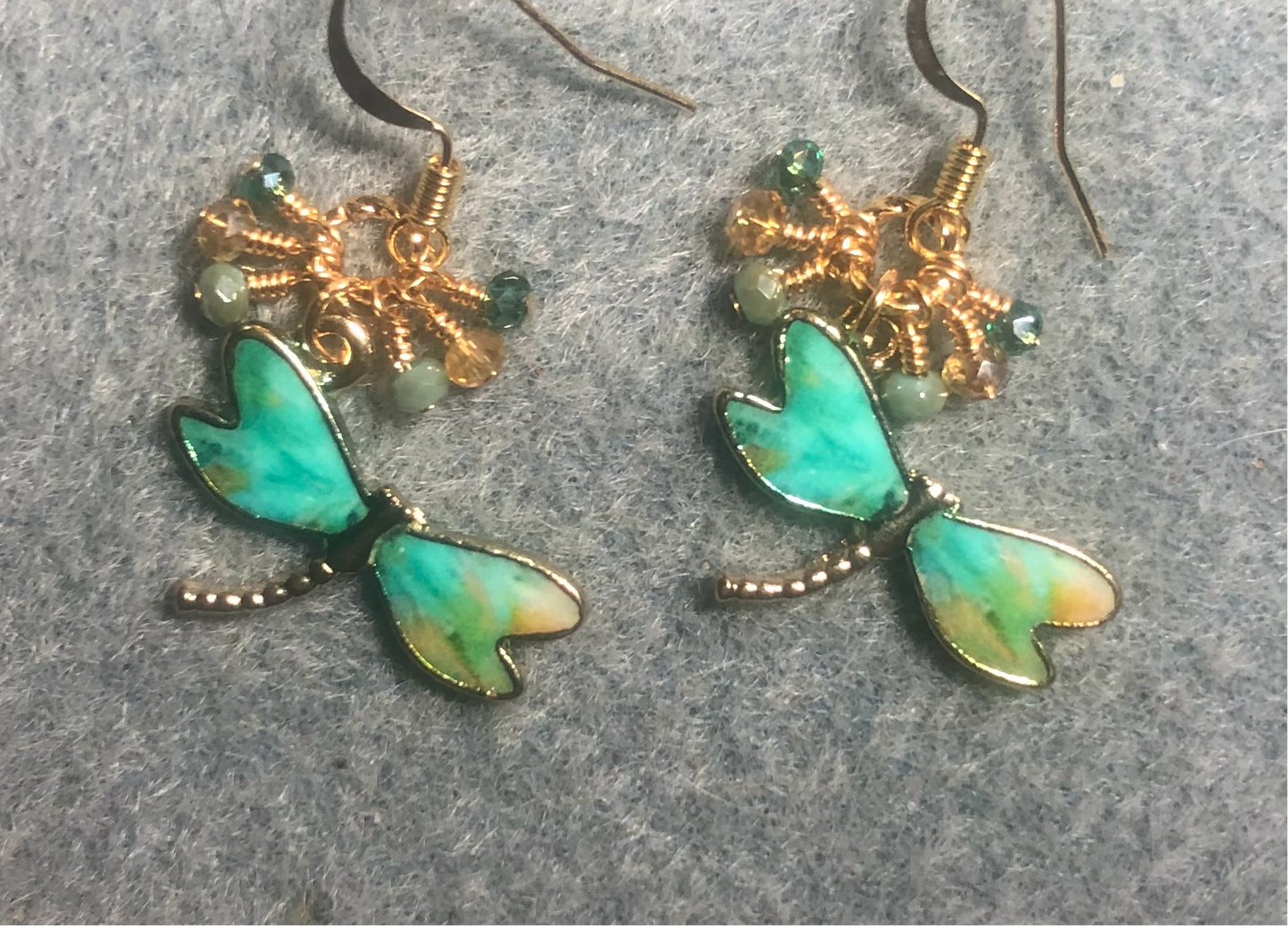 Teal, green, and amber enamel dragonfly charm earrings adorned with tiny dangling teal, green, and amber Chinese crystal beads.