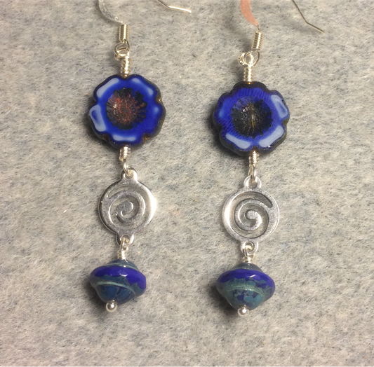 Opaque bright blue Czech glass pansy bead earrings adorned with silver swirly connectors and opaque blue Czech glass Saturn beads.