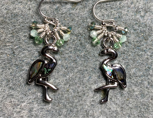 Silver and abalone flamingo charm earrings adorned with tiny dangling light green Chinese crystal beads.