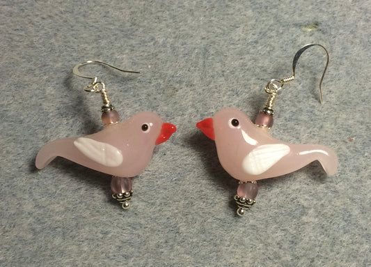 Milky pink and white lamp work songbird bead earrings adorned with light pink Czech glass beads.