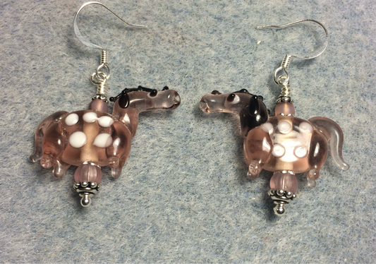Translucent rose pink lamp work spotted horse bead earrings adorned with rose pink Czech glass beads.