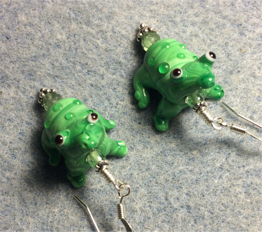 Green lamp work frog bead earrings adorned with green Czech glass beads.