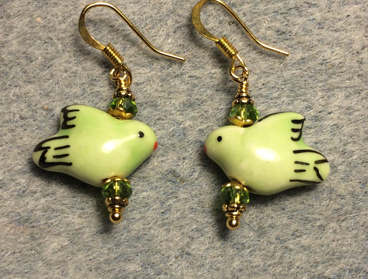 Green ceramic dove bead earrings adorned with green Chinese crystal beads.
