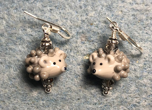 Small gray lamp work hedgehog bead earrings adorned with clear Chinese crystal beads.