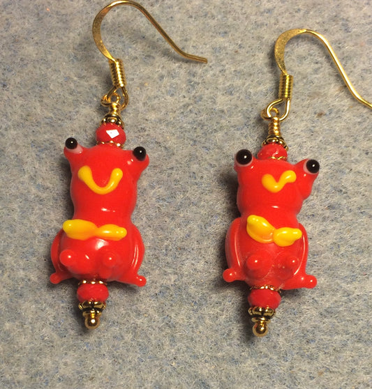 Red and yellow lamp work silly frog bead earrings adorned with red Chinese crystal beads.