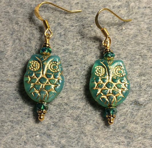 Light teal (with gold wash) Czech glass owl bead earrings adorned with teal Chinese crystal beads.