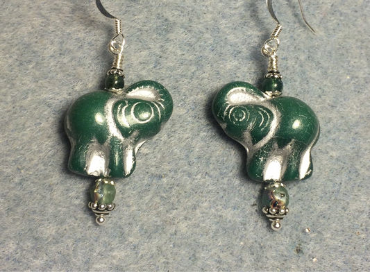 Dark green (with silver inlay) Czech glass elephant bead earrings adorned with green Czech glass beads.