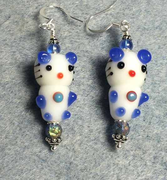 White and blue lamp work cartoon cat bead earrings adorned with blue Czech glass beads.