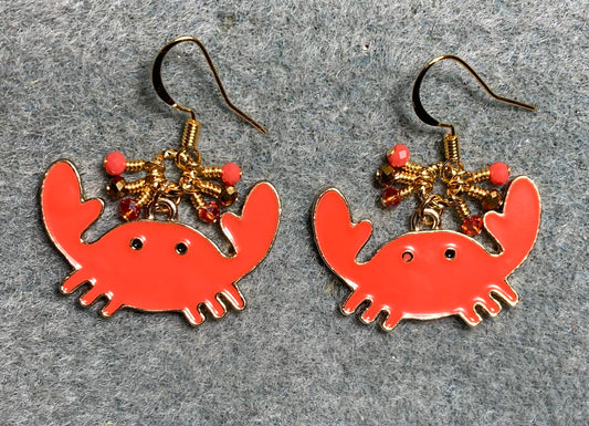 Large orange and gold enamel crab charm earrings adorned with tiny dangling orange and gold Chinese crystal beads.