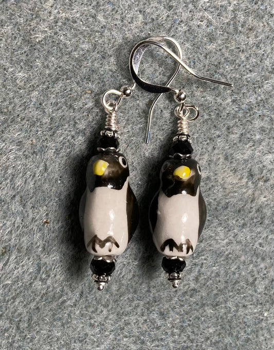 Black and white ceramic penguin bead earrings adorned with black Chinese crystal beads.