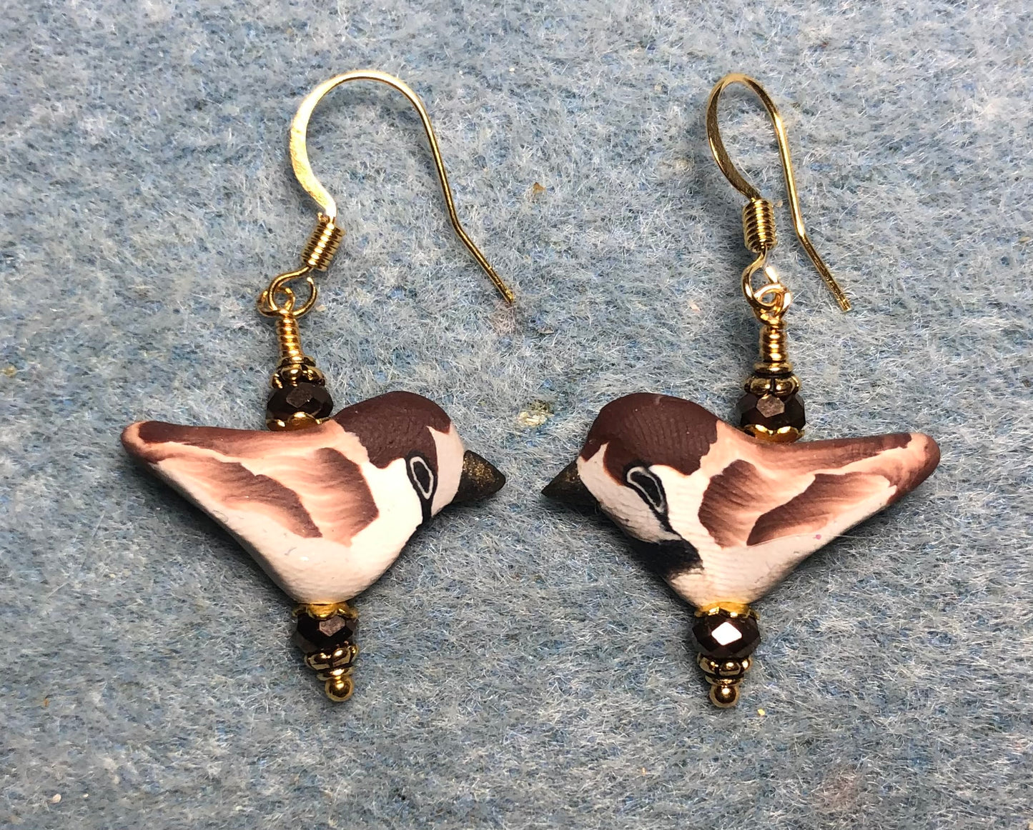 Brown and tan polymer clay bird bead earrings adorned with brown Chinese crystal beads.