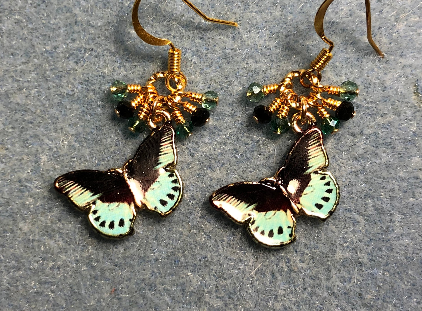 Teal and black enamel dragonfly charm earrings adorned with tiny dangling teal and black Chinese crystal beads.