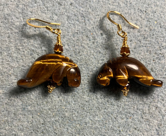 Tigereye gemstone manatee bead earrings adorned with dark amber Chinese crystal beads.