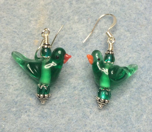Translucent teal lamp work songbird bead earrings adorned with teal Czech glass beads.
