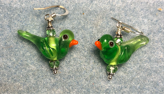 Translucent green lamp work songbird bead earrings adorned with green Chinese crystal beads.