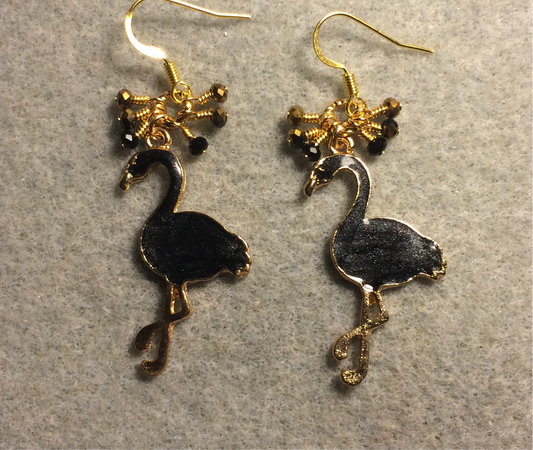 Black enamel flamingo charm earrings adorned with tiny dangling black and gold Chinese crystal beads.