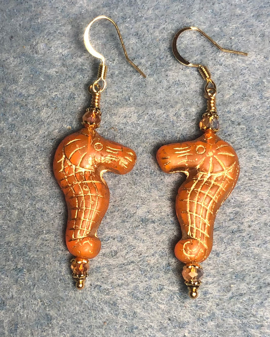 Tangerine (with gold inlay) Czech glass seahorse bead earrings adorned with tangerine Chinese crystal beads.