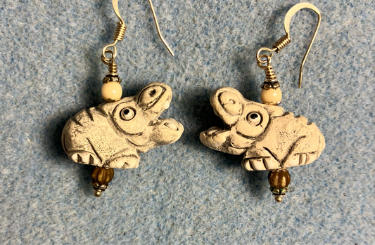 Large off white ceramic hippopotamus bead earrings adorned with off white Czech glass beads.