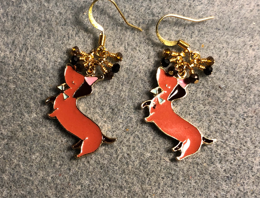 Brown and black enamel dachshund charm earrings adorned with tiny dangling brown, black, and amber Chinese crystal beads.