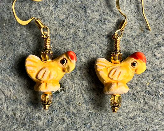 Small amber and red ceramic chicken bead earrings adorned with amber Chinese crystal beads.