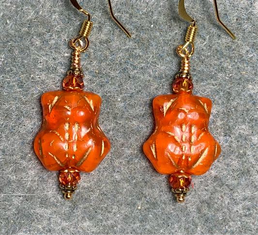 Orange (with gold inlay) Czech glass frog bead earrings adorned with orange Chinese crystal beads.