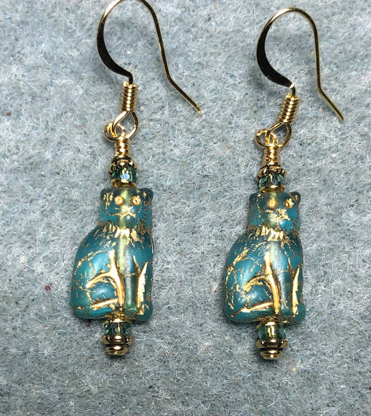 Small turquoise and gold Czech glass cat bead earrings adorned with turquoise Chinese crystal beads.