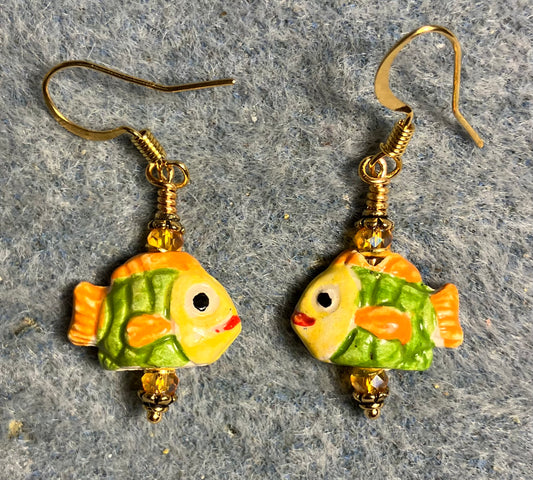 Small tangerine, yellow, and green ceramic fish bead earrings adorned with tangerine Chinese crystal beads.