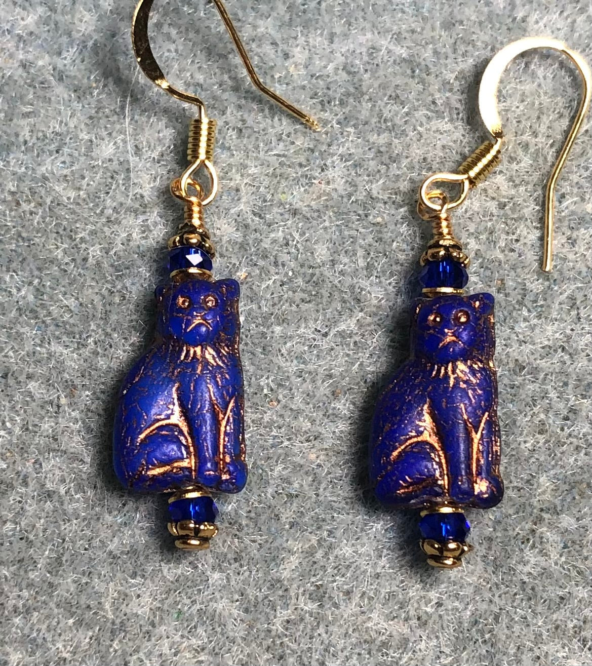 Small opaque bright blue (with gold inlay) Czech glass cat bead earrings adorned with bright blue Chinese crystal beads.