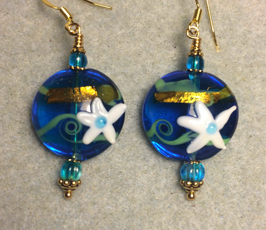 Turquoise, white, and gold lamp work starfish bead earrings adorned with turquoise Czech glass beads.