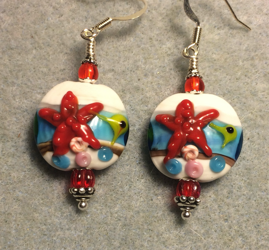 White, blue, and red lamp work starfish bead earrings adorned with red Czech glass beads.