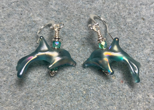 Tiny matte teal lamp work dolphin bead earrings adorned with tiny teal Chinese crystal beads.