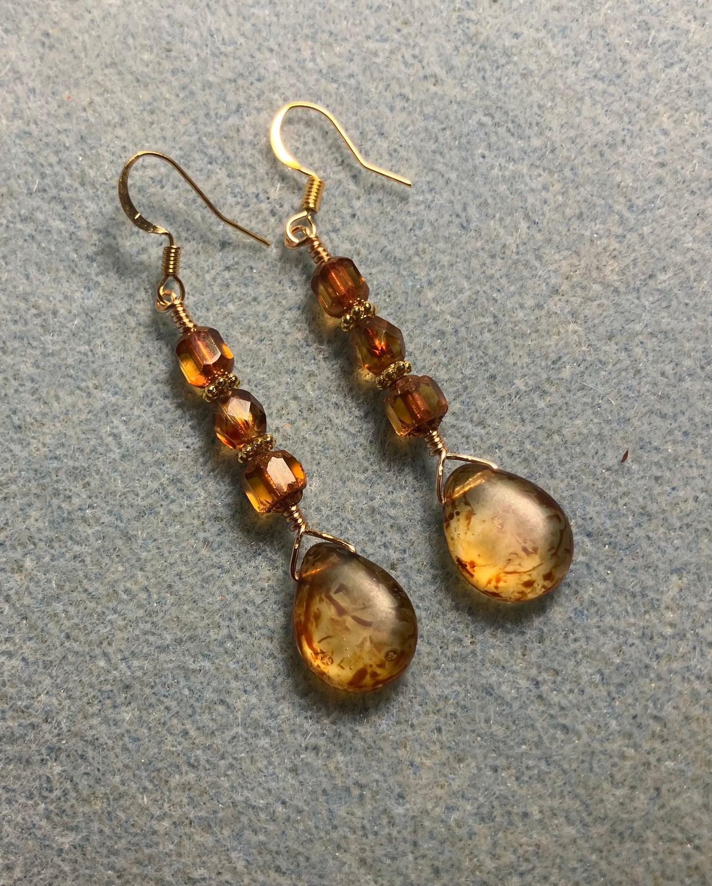 Amber brown Czech glass pear drop bead earrings adorned with dark amber Czech glass beads.