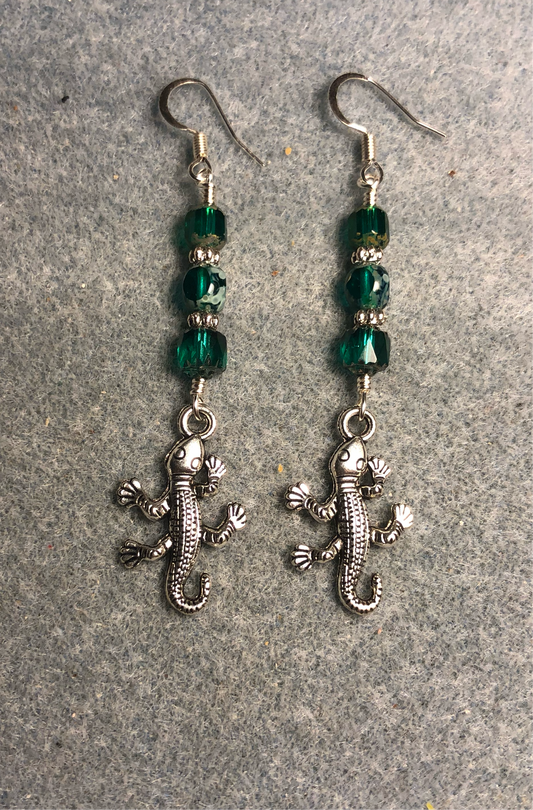 Silver lizard charm earrings adorned with teal Czech glass beads.