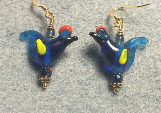 Translucent bright blue red crested lamp work songbird bead earrings adorned with bright blue Czech glass beads.