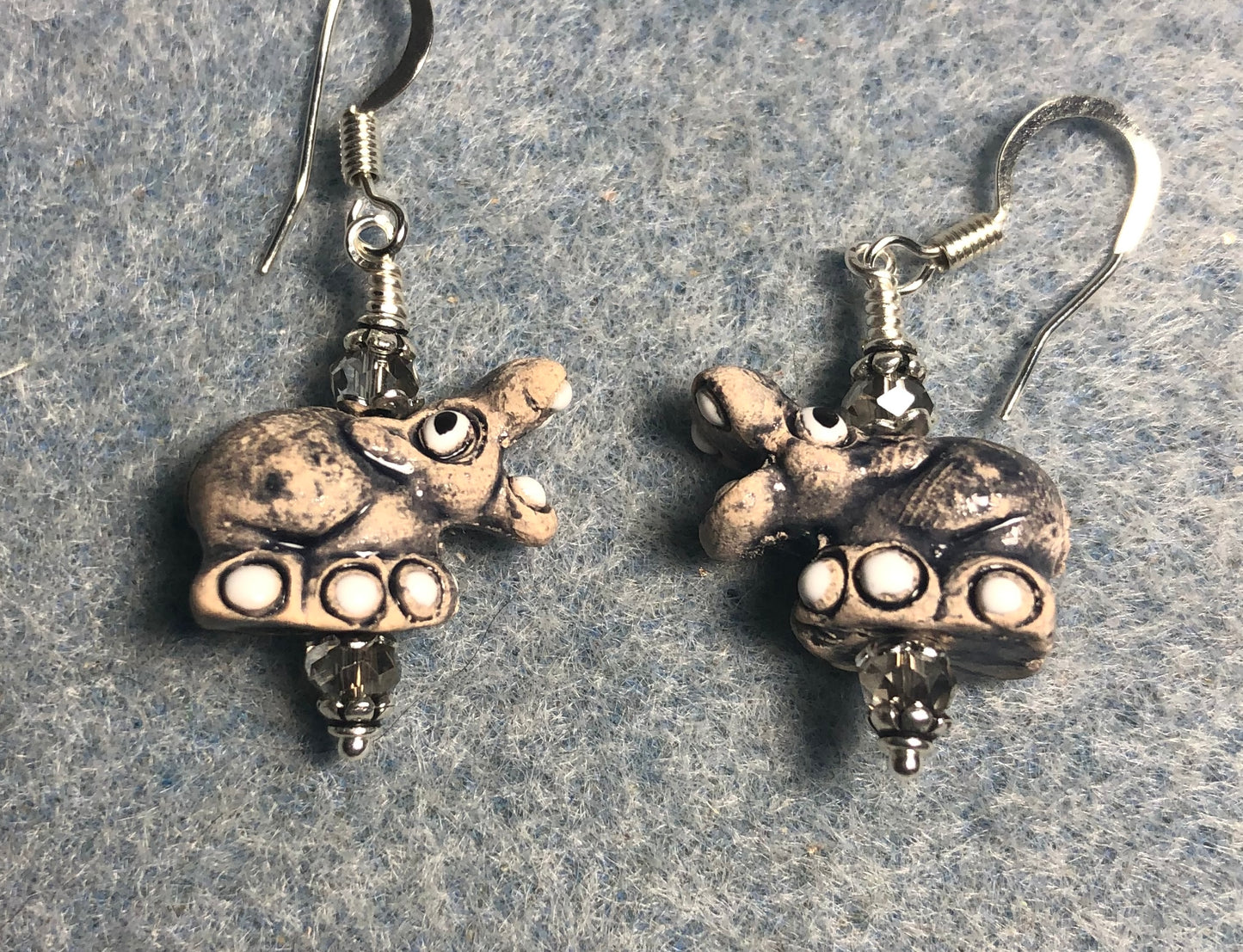 Small gray and white ceramic hippopotamus bead earrings adorned with gray Chinese crystal beads.