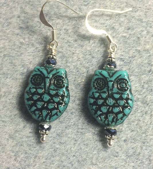 Teal (with black wash) Czech glass owl bead earrings adorned with teal Chinese crystal beads.