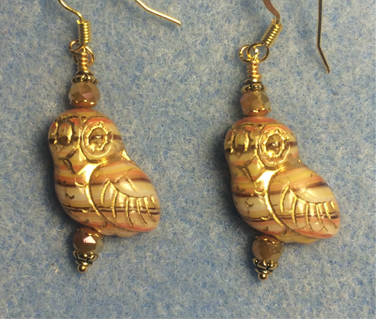 Tan, orange, and brown striped (with gold wash) fancy Czech glass owl bead earrings adorned with tan Chinese crystal beads.