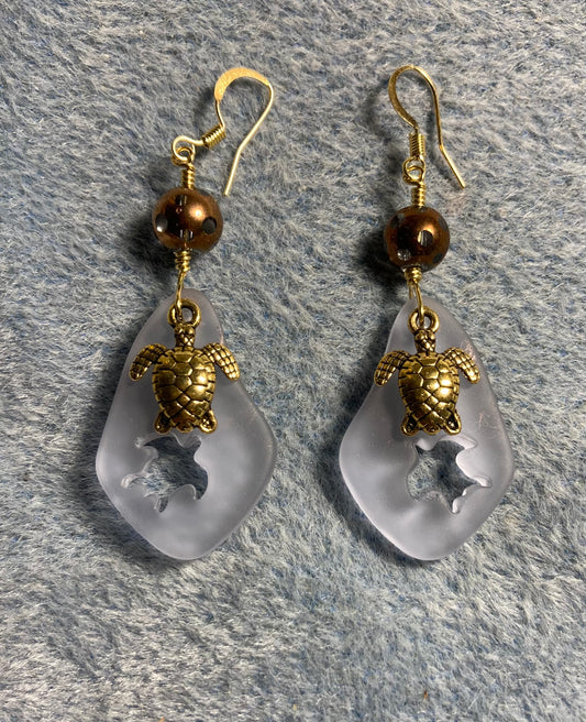 Light blue sea glass sea turtle pendant bead earrings adorned with gold sea turtle charms and light blue and gold Czech glass beads.