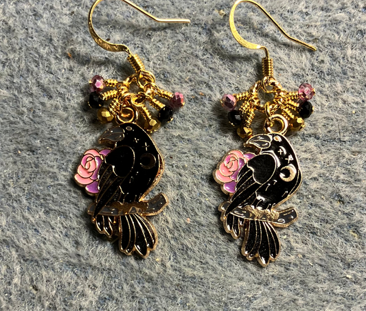 Black, gold, and pink enamel raven charm earrings adorned with tiny dangling black, gold, and pink Chinese crystal beads.