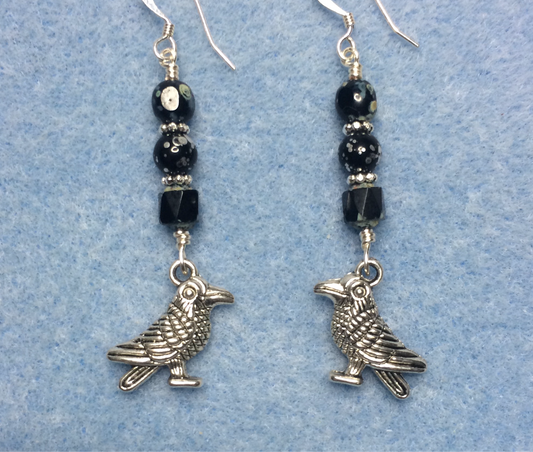 Silver raven charm earrings adorned with black Czech glass beads