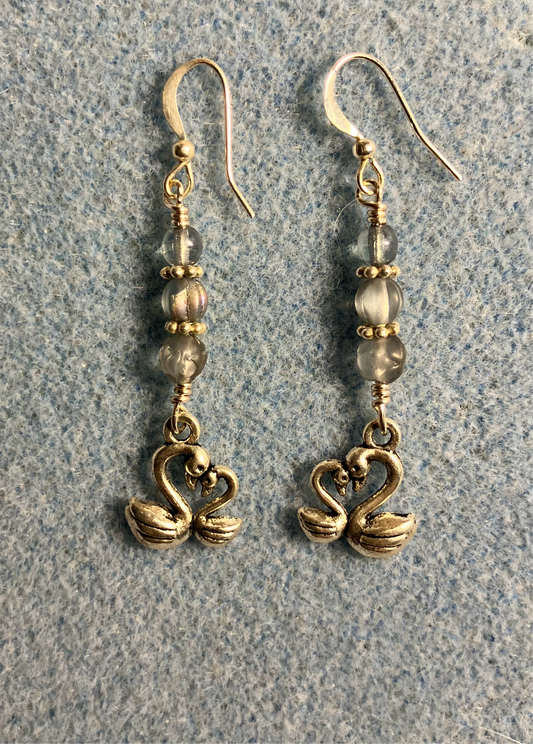 Small silver swan charm earrings adorned with small light blue Czech glass beads
