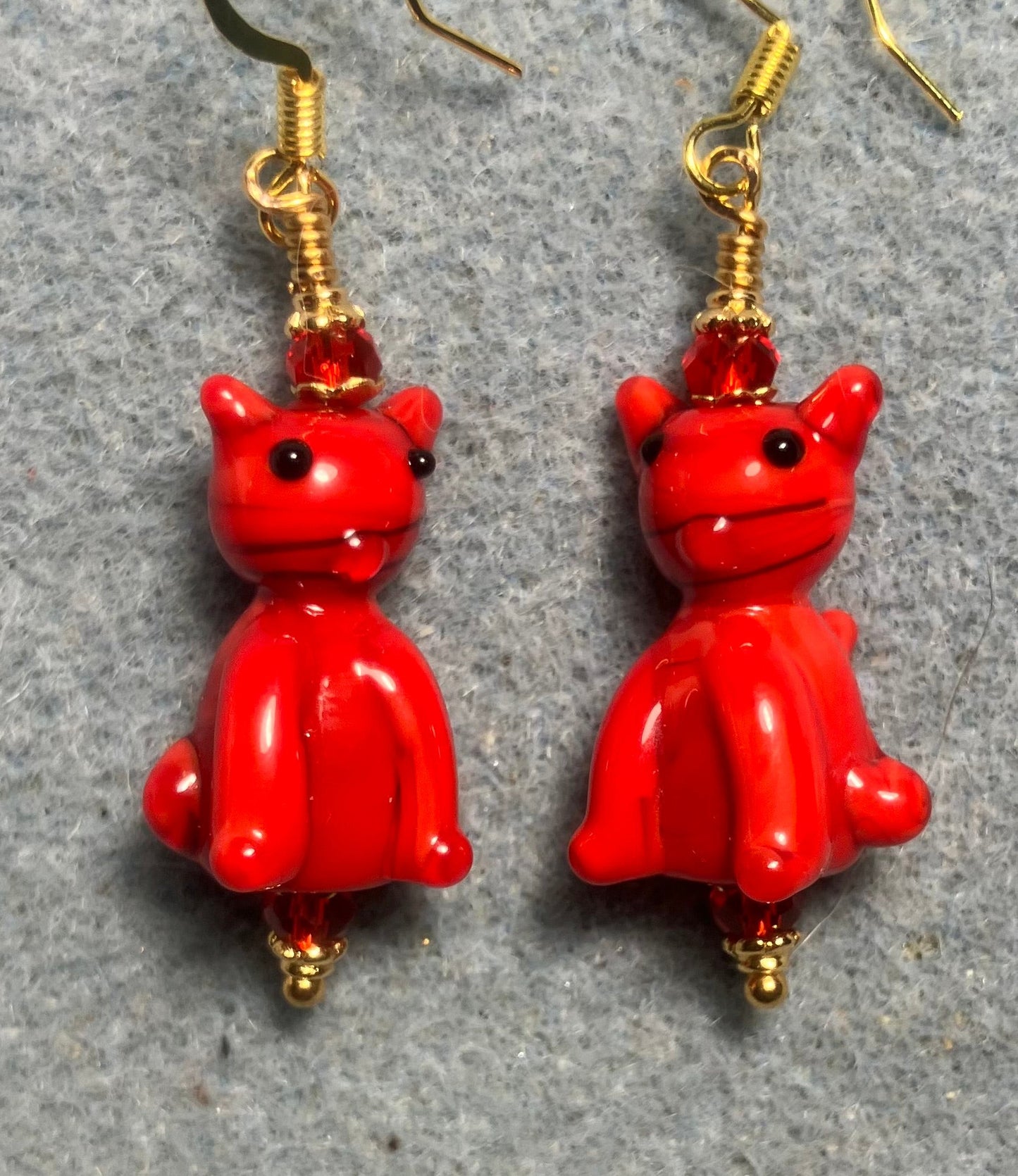 Opaque red lamp cat bead earrings adorned with red Chinese crystal beads.
