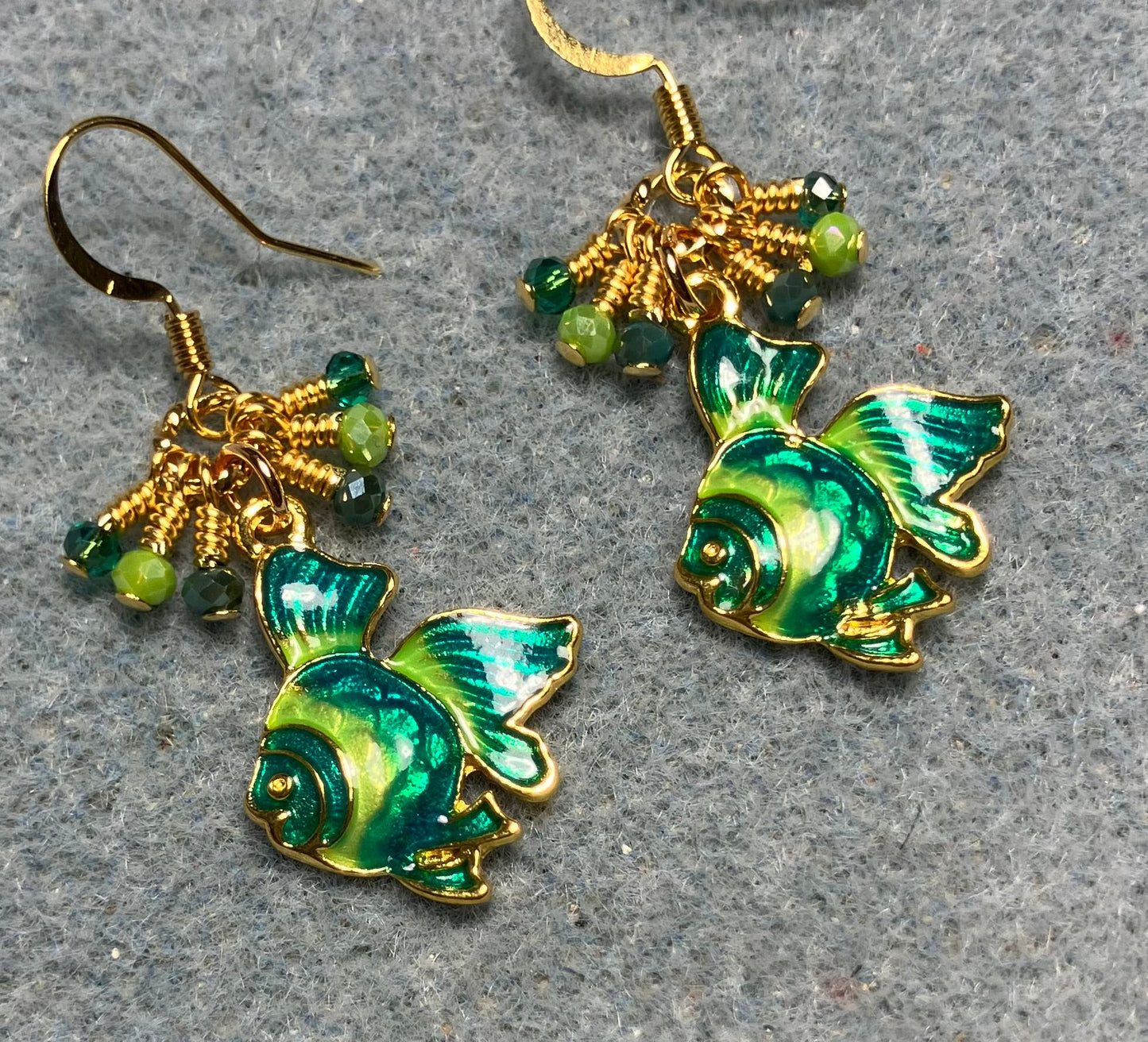 Teal and lime green enamel angelfish charm earrings adorned with tiny dangling teal and lime green Chinese crystal beads.