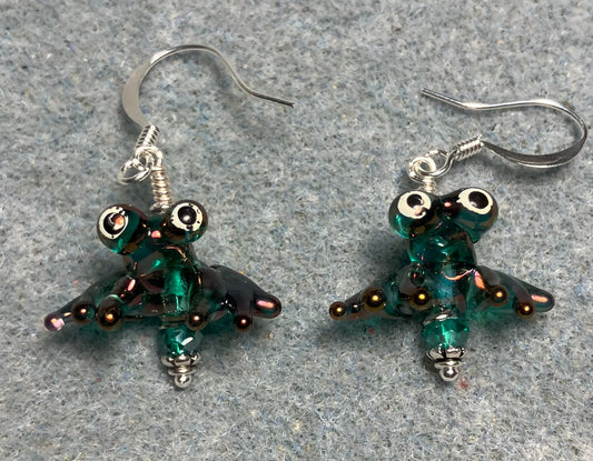 Tiny aurora borealis teal lamp work frog bead earrings adorned with tiny teal Chinese crystal beads.