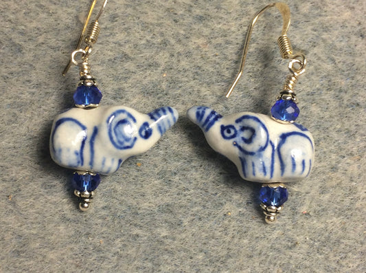 Small white and blue ceramic elephant bead earrings adorned with blue Chinese crystal beads.