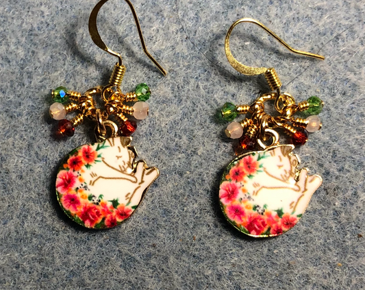 White, red, and green enamel sleeping cat charm earrings adorned with tiny dangling white, red, and green Chinese crystal beads.