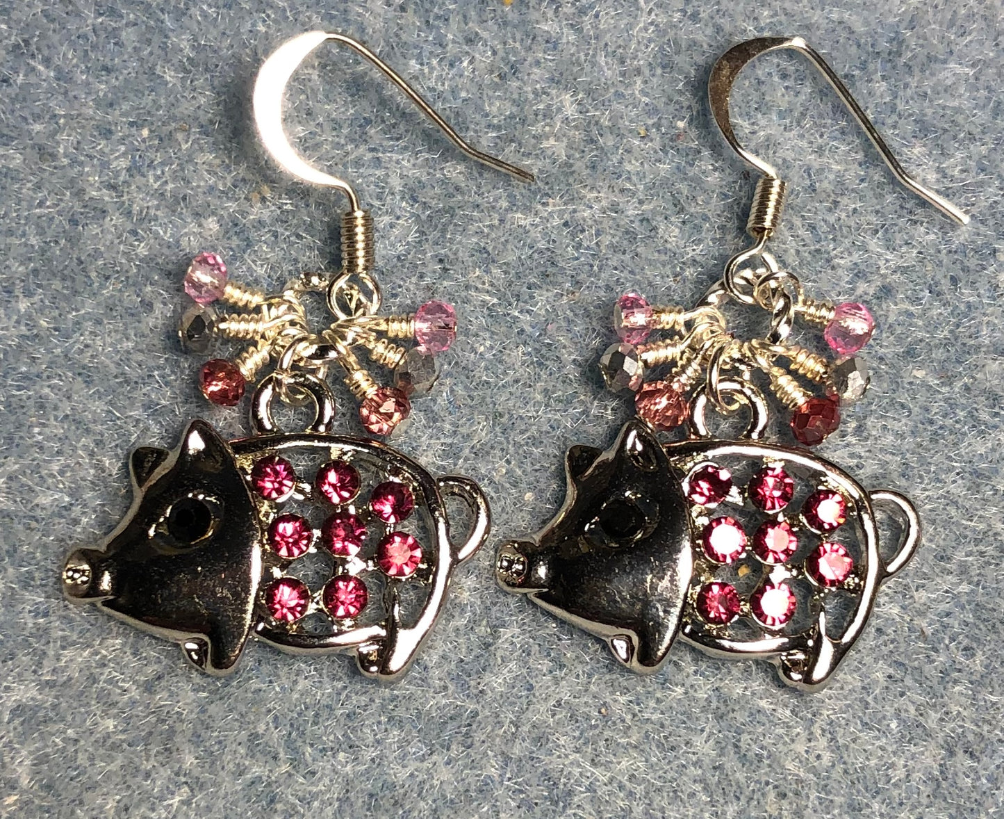 Silver and pink rhinestone pig charm earrings adorned with tiny dangling silver and pink Chinese crystal beads.