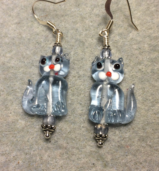 Translucent light blue lamp work cat bead earrings adorned with light blue Czech glass beads.
