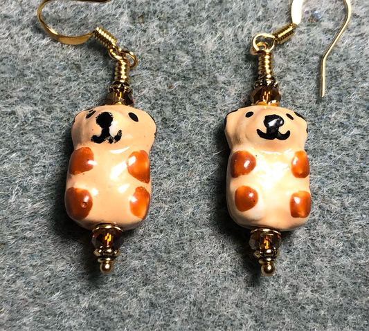 Beige and tangerine ceramic teddy bear bead earrings adorned with tangerine Chinese crystal beads.