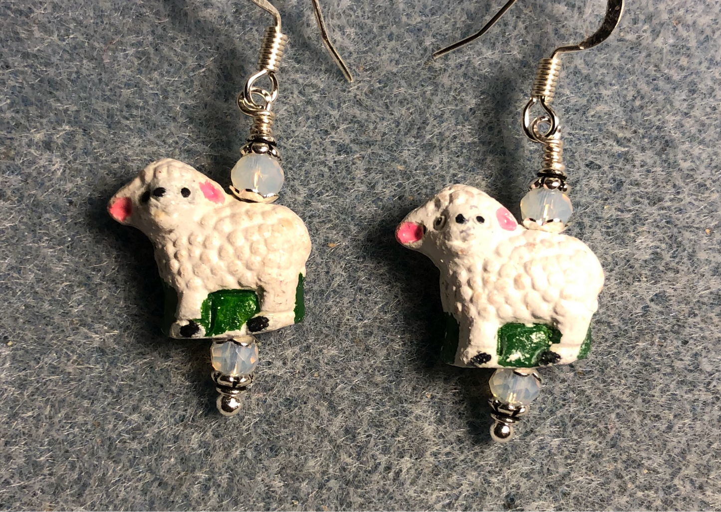 Small white, green, and pink ceramic sheep bead earrings adorned with white Chinese crystal beads.